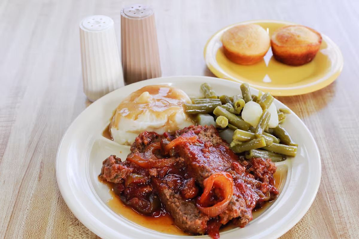 K & K Soul Food signature dishes Meat Loaf dinner, Peach Cobbler, Fat Back.